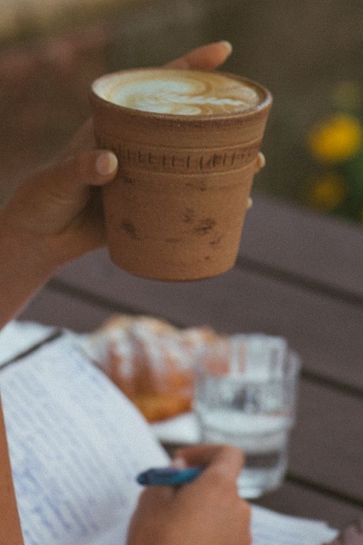 human-centric marketing - a coffee cup being held by a woman