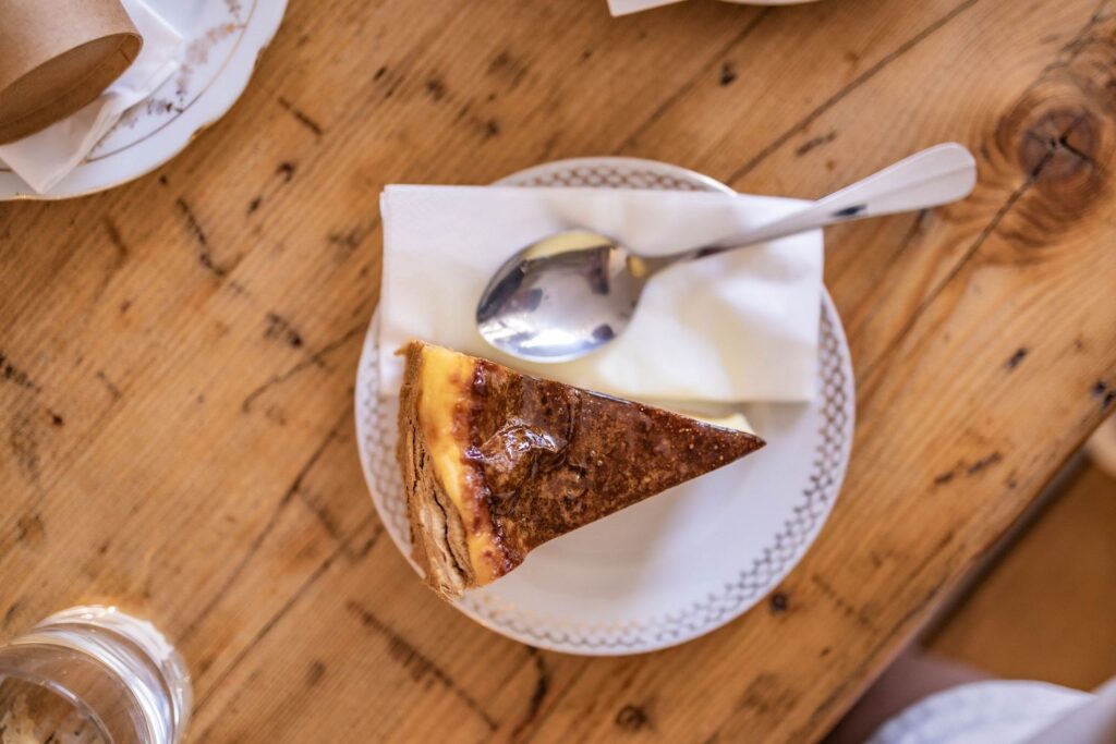 A slice of tart on a wooden table